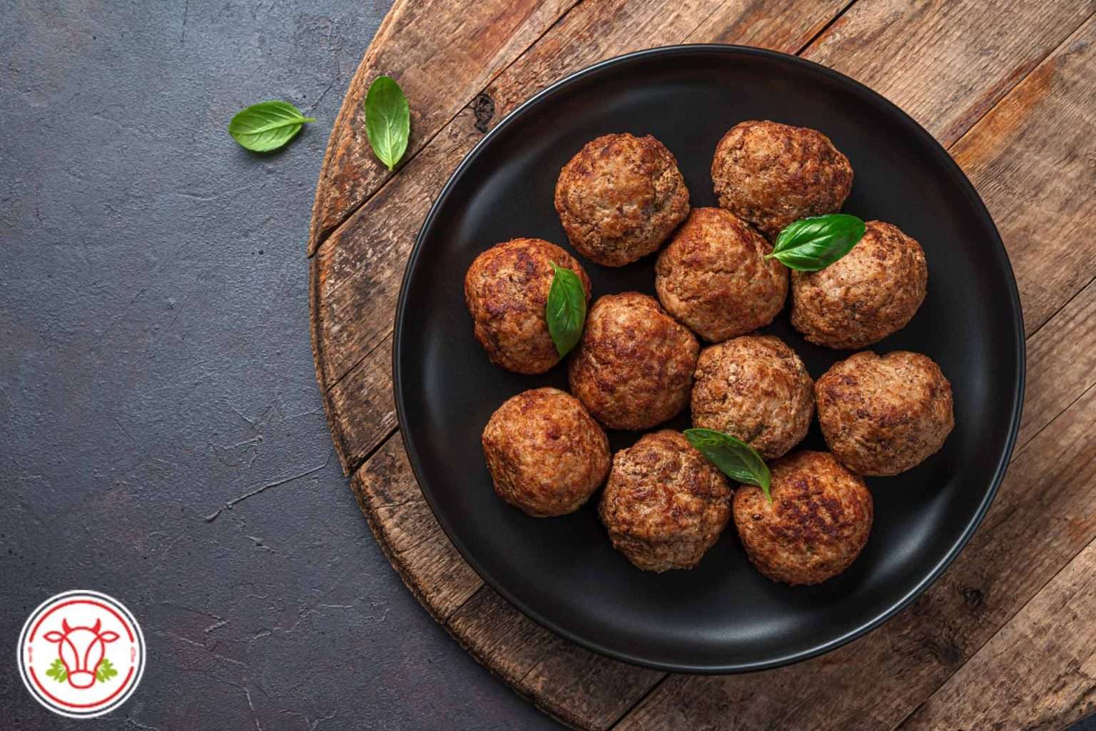 Halal ground beef meatballs in marinara sauce for potluck party food in slow cooker or foil pan